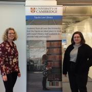 Library team members with welcome banner